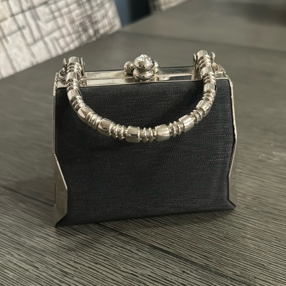 Black satin and silver small handbag. With metal handle